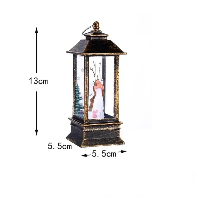 A decorative lantern-shaped ornament with a winter fairy figurine inside, shown with dimension arrows and labels indicating 13cm height and 5.5cm width on a white background.