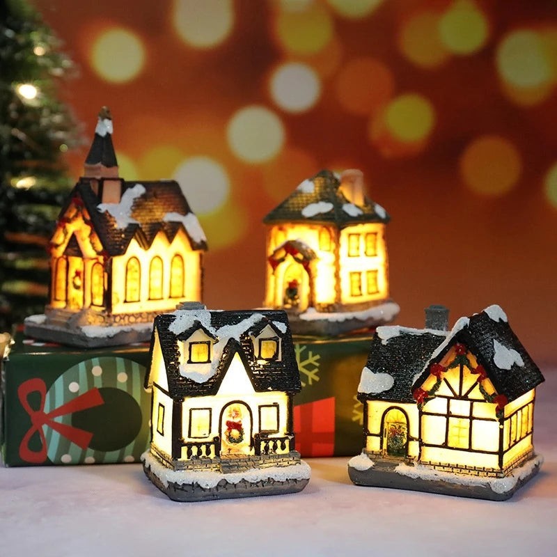 Set of miniature illuminated houses with a festive background
