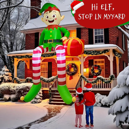 TK-H Merchandise 8ft inflatable sitting elf with LED lights displayed on a snowy porch for Christmas home decor